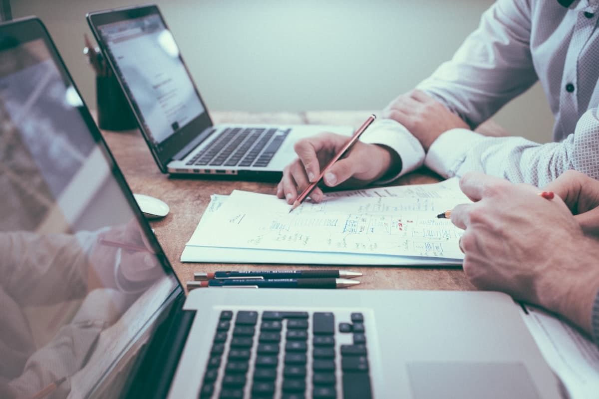 Advisors reviewing financial documents and plans at a desk